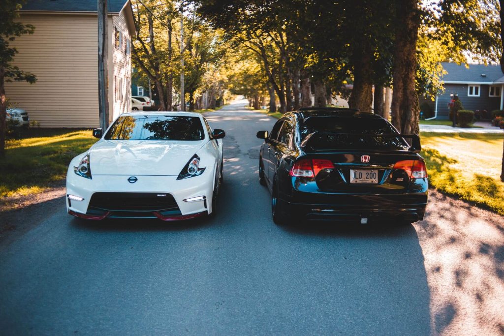 white and black sports cars